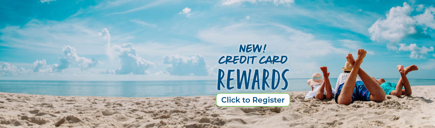 Father with daughter and son laying on their stomachs with their feet in the air on the beach looking out at the water. Text reads New! Credit card rewards. Click to register. 
