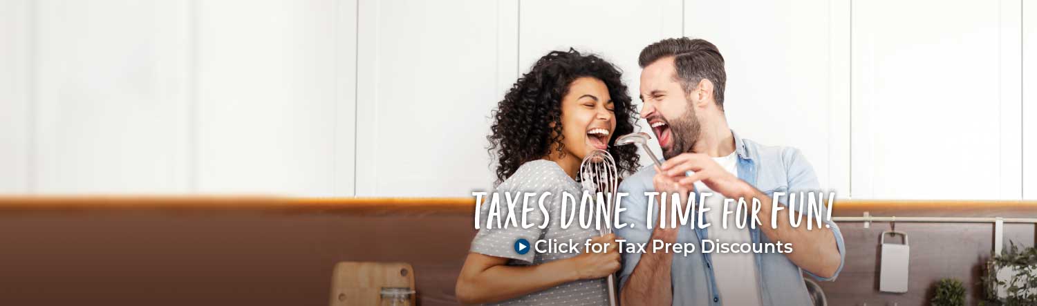  A young couple in a kitchen. The woman is singing into a whisk and the man is looking at her and singing into a ladle. Text over the image reads Taxes Done. Time for Fun! Click for tax prep discounts.